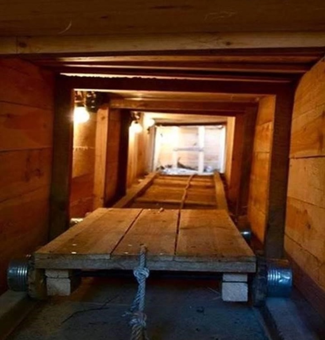 Replica support structure of a Stalag Luft III escape tunnel